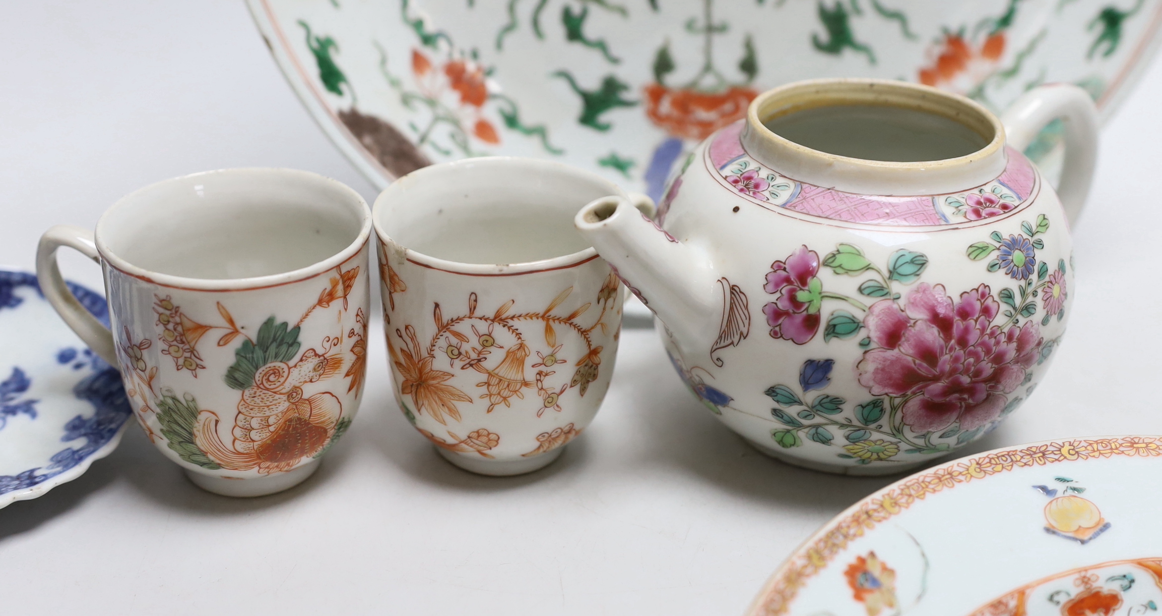 Collection of 18th century Chinese porcelain including an armorial dish, teapot hand painted in the famille rose palette and pair of cups hand painted with flowers, the largest 28cm high